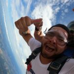 Skydiving over hill country